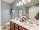 Bathroom features double sink vanity, shower, and well-lit mirror and decor at 2914 Glenarden Dr, Charleston, SC 29414