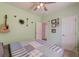 Comfortable bedroom with a ceiling fan, soft carpet, and decorated walls at 2914 Glenarden Dr, Charleston, SC 29414
