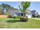 Charming single-Gathering home featuring a well-maintained lawn and a two-car garage at 2914 Glenarden Dr, Charleston, SC 29414