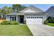 Charming one-story home with a two-car garage, manicured lawn, and tasteful landscaping at 2914 Glenarden Dr, Charleston, SC 29414