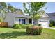 Beautiful single-story house with lush front yard, flowering bushes, and tidy, verdant lawn at 2914 Glenarden Dr, Charleston, SC 29414