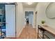 Hallway with wood floors and view to a distant space, white walls, modern furniture and decorative elements at 2914 Glenarden Dr, Charleston, SC 29414