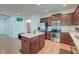 Modern kitchen features dark wood cabinets, stainless steel appliances, and an island with granite counters at 2914 Glenarden Dr, Charleston, SC 29414