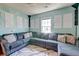 Living room with a large gray sectional sofa, patterned throw pillows, a patterned rug and sound dampening decor at 2914 Glenarden Dr, Charleston, SC 29414