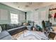 Living room with a large gray sectional sofa, patterned throw pillows, a patterned rug and sound dampening decor at 2914 Glenarden Dr, Charleston, SC 29414