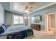 Spacious main bedroom with tray ceiling, TV, ample windows, and access to the ensuite bath at 2914 Glenarden Dr, Charleston, SC 29414