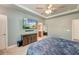 Main bedroom boasts ensuite bath access, flatscreen TV, neutral walls, and ceiling fan at 2914 Glenarden Dr, Charleston, SC 29414