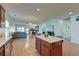 Bright open concept featuring a kitchen island, view of the living room, and lots of natural light at 2914 Glenarden Dr, Charleston, SC 29414
