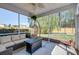 Cozy screened-in porch with comfortable seating and views of the backyard at 2914 Glenarden Dr, Charleston, SC 29414