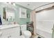 Well-lit bathroom with a vanity, toilet, and shower/tub combination at 2933 Atrium Villa Dr # 33, Seabrook Island, SC 29455
