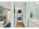 The bathroom includes a modern stacked washer and dryer, plus a tub with multi-color polka dot shower curtain at 2933 Atrium Villa Dr # 33, Seabrook Island, SC 29455