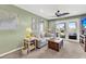 Relaxing living area with stylish furnishings, a ceiling fan, and balcony access at 2933 Atrium Villa Dr # 33, Seabrook Island, SC 29455