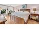 Bright bedroom with wood flooring, a king-size bed, and natural light at 2933 Atrium Villa Dr # 33, Seabrook Island, SC 29455