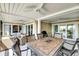 Inviting porch with dining table and comfortable wicker seating offering scenic neighborhood views at 2933 Atrium Villa Dr # 33, Seabrook Island, SC 29455