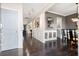 Bright hallway featuring hardwood floors, decorative moldings, and open access to the dining room at 301 Dunlin Dr, Summerville, SC 29486