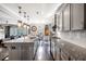 Open concept kitchen with granite countertops, stainless steel appliances, and hardwood flooring at 301 Dunlin Dr, Summerville, SC 29486