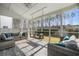 Relaxing screened porch featuring comfortable seating and scenic views of the surrounding backyard at 301 Dunlin Dr, Summerville, SC 29486