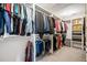 Spacious walk-in closet with built-in shelving and hanging rods offering efficient storage and organization at 301 Dunlin Dr, Summerville, SC 29486