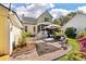 A serene backyard featuring a patio, deck, and beautifully landscaped area for outdoor relaxation at 3023 Macbeth Creek Dr, Charleston, SC 29414