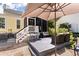 Relaxing backyard deck offers outdoor seating under a large umbrella at 3023 Macbeth Creek Dr, Charleston, SC 29414