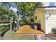 Backyard deck with lush greenery, mature trees, and a string of decorative lights at 3023 Macbeth Creek Dr, Charleston, SC 29414