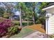 A wood deck sits beside a yard full of azaleas and mature trees at 3023 Macbeth Creek Dr, Charleston, SC 29414