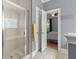Modern bathroom features a glass shower, and a view into the bedroom, and clean, bright space at 3023 Macbeth Creek Dr, Charleston, SC 29414