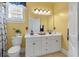 This bathroom features a double vanity with a white countertop, storage underneath and two sinks at 3023 Macbeth Creek Dr, Charleston, SC 29414