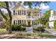 Charming two-story home with a welcoming front porch and beautiful landscaping at 3023 Macbeth Creek Dr, Charleston, SC 29414
