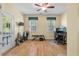 This home gym has a ceiling fan, two windows, hardwood floors and contains an adjustable weight bench at 3023 Macbeth Creek Dr, Charleston, SC 29414
