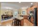 Open kitchen with a center island, granite countertops, and stainless steel appliances at 3023 Macbeth Creek Dr, Charleston, SC 29414