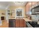 Kitchen sink with granite countertops, stainless steel appliances, and backsplash at 3023 Macbeth Creek Dr, Charleston, SC 29414