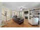 Comfortable living room with hardwood floors, a fireplace, and ample natural light at 3023 Macbeth Creek Dr, Charleston, SC 29414