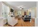 Spacious living room with hardwood floors, a fireplace, and plenty of seating for guests at 3023 Macbeth Creek Dr, Charleston, SC 29414