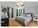 Serene primary bedroom with hardwood floors, gray accents, and plenty of natural light at 3023 Macbeth Creek Dr, Charleston, SC 29414