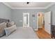 Light-filled primary bedroom showcasing hardwood floors, doorway, and access to other rooms at 3023 Macbeth Creek Dr, Charleston, SC 29414