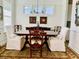 Formal dining room with elegant furniture and neutral decor, illuminated by a chandelier at 3025 Dewitt Ct, Hollywood, SC 29449