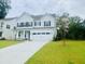 Attractive two-story home with well-maintained lawn, a two-car garage and covered porch at 3025 Dewitt Ct, Hollywood, SC 29449