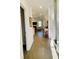 Bright hallway with hardwood floors leading to an open-concept living area at 3025 Dewitt Ct, Hollywood, SC 29449
