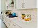 Spacious kitchen with quartz countertops and stylish backsplash at 3025 Dewitt Ct, Hollywood, SC 29449