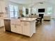 Open concept kitchen with a big island, farmhouse sink, and stainless steel appliances at 3025 Dewitt Ct, Hollywood, SC 29449