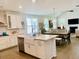 Spacious kitchen island with farmhouse sink, stainless steel dishwasher, and modern finishes at 3025 Dewitt Ct, Hollywood, SC 29449