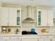 Modern kitchen featuring white cabinets, light countertops, and stainless steel appliances at 3025 Dewitt Ct, Hollywood, SC 29449