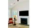 Bright living room features a fireplace, vaulted ceiling, and large windows overlooking the property at 3025 Dewitt Ct, Hollywood, SC 29449