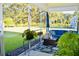 Screened porch with outdoor furniture, including a sofa, a coffee table, potted plants, and a view of the backyard at 3025 Dewitt Ct, Hollywood, SC 29449