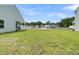 Spacious backyard with lush green grass, offering plenty of room for outdoor activities and relaxation at 309 Torslanda Ln, Summerville, SC 29486