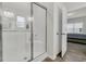 Modern bathroom with shower and partial view of the bedroom creating open flow at 309 Torslanda Ln, Summerville, SC 29486