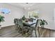 Formal dining room with elegant chandelier and large window allowing abundant natural light at 309 Torslanda Ln, Summerville, SC 29486