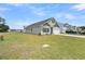 Charming single-Gathering home with a manicured lawn, driveway, and a two-car garage at 309 Torslanda Ln, Summerville, SC 29486