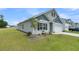 Well-maintained gray home with a white garage door, landscaping, and a tidy lawn on a corner lot at 309 Torslanda Ln, Summerville, SC 29486